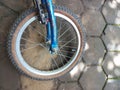 a bicycle wheel lying on the ground Royalty Free Stock Photo