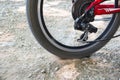 Bicycle wheel in motion close-up. Land with under the wheels Royalty Free Stock Photo