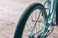 Bicycle wheel and pedals close-up on the wooden embankment Royalty Free Stock Photo