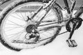bicycle wheel in snow and ice in cold winter weather close-up with details Royalty Free Stock Photo