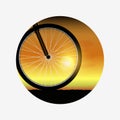 Bicycle wheel at sunset, silhouette of bike forward to sun