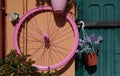 bicycle wheel on a wall, Sardinia, Olbia, Italy