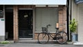 Bicycle with a wicker basket parked on city street in front of brick wall exterior facade of classic cafe. Royalty Free Stock Photo
