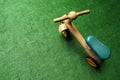 Bicycle wooden toy on Artificial grass. Wooden bicycle toy for kids.