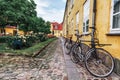 Bicycles with baskets in a European courtyard