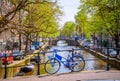 Bicycles on the bridge in  Amsterdam, Netherlands. Canals of Amsterdam Royalty Free Stock Photo