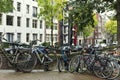 Bicycles on a bridge in Amsterdam on a rainy autumn day Royalty Free Stock Photo