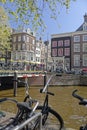 Bicycles on bridge over canal, Amsterdam, Holland