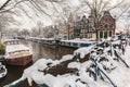 Bicycles covered with snow in Amsterdam