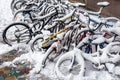 Bicycles covered with snow during winter. Bikes in snow. Snow storm in the city Royalty Free Stock Photo