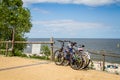 Bicycles leaning against wooden fence Royalty Free Stock Photo