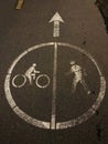 Bicycles Left Pedestrians Right White Painted Road Sign Royalty Free Stock Photo