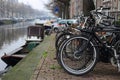 Bicycles lining a bridge over the canals of Amsterdam, Netherlands Royalty Free Stock Photo