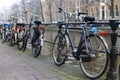 Bicycles lining a bridge over the canals of Amsterdam, Netherlands Royalty Free Stock Photo