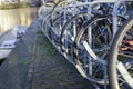 Bicycles lining a bridge over the canals of Amsterdam, Netherlands Royalty Free Stock Photo