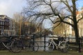 Bicycles lining a bridge over the canals of Amsterdam, Netherlands Royalty Free Stock Photo