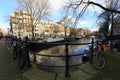 Bicycles lining a bridge over the canals of Amsterdam, Netherlands Royalty Free Stock Photo