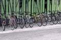 Bicycles near a green wall