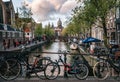 Bicycles parked along the bridge. Canal of Amsterdam Royalty Free Stock Photo