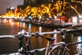 Bicycles Parked Along a Bridge Over the Canals of Amsterdam Royalty Free Stock Photo
