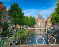 Bicycles parked in a bridge across the canal in Amsterdam, Netherlands Royalty Free Stock Photo