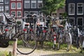 Bicycles parked on a bridge in Amsterdam, The Netherlands. A lot of parked bikes on the pavement. Royalty Free Stock Photo