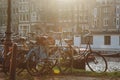 bicycles parked near canal at Amsterdam, Netherlands Royalty Free Stock Photo