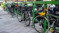 Bicycles parked at a side walk. Royalty Free Stock Photo