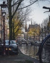 Bicycles parked up next to the canal in autumn in Amsterdam, Netherlands Royalty Free Stock Photo