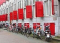 Students bikes at an old building with red shutters,Utrecht,Netherlands Royalty Free Stock Photo