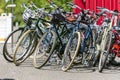 Bicycles for rent and city trips are standing near the container waiting for cyclists