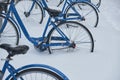 Bicycles rent station in the snow Royalty Free Stock Photo