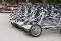 Bicycles for rent steel black pedal. Parked rental tourist trike vehicles velomobiles. Ecological urban transport