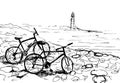 Bicycles on the sea shore. Lighthouse in the background