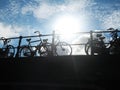 Bicycles silhouette on bridge in Amsterdam with sunny sky Royalty Free Stock Photo