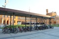 Bicycles at Wroclaw main railway station building at sunset.