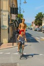 Bicycling boys on the street of small town Vada, Italy