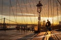 Bicyclist on Brooklyn Bridge during sunrise in New York. USA Royalty Free Stock Photo