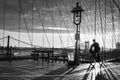 Bicyclist on Brooklyn Bridge during sunrise in New York. USA Royalty Free Stock Photo