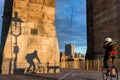 Bicyclist on Brooklyn Bridge during sunrise in New York. USA Royalty Free Stock Photo