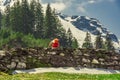 Bicyclist climbing Swiss Alps in spring