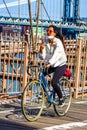 Bicyclist crossing empty Brooklyn Bridge during the coronavirus COVID-19 pandemic lockdown in New York City Royalty Free Stock Photo