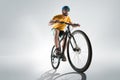 The bicyclist on gray, studio shot.