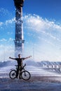 The Bicyclist with his Bicycle in a Fountain Royalty Free Stock Photo