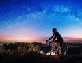 Bicyclist with mountain bike on top of the hill Royalty Free Stock Photo