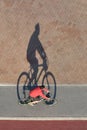 Bicyclist riding bicycle top view with shadow