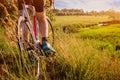 Bicyclist riding down the field to the river Royalty Free Stock Photo