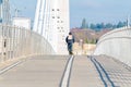 Bicyclist riding on the empty bridge