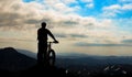 Bicyclist silhouette on mountain Royalty Free Stock Photo