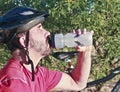 A Bicyclist Stops for a Water Break Royalty Free Stock Photo